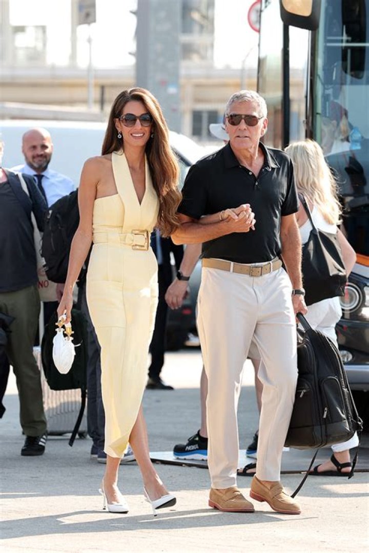 Amal Clooney’s ’70s-style plaid pants & vinyl DVF coat: love it or hate it?