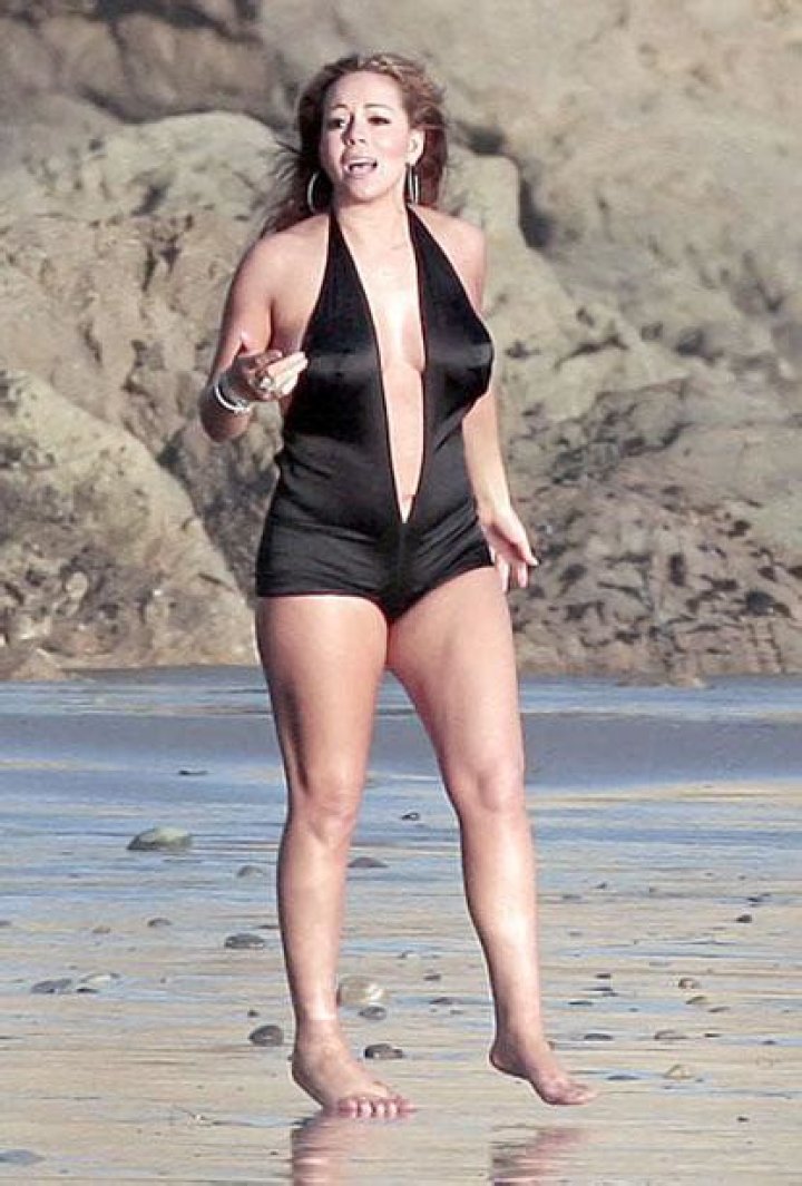 Mariah Carey dons unflattering swimsuit, talks about abuse in her past