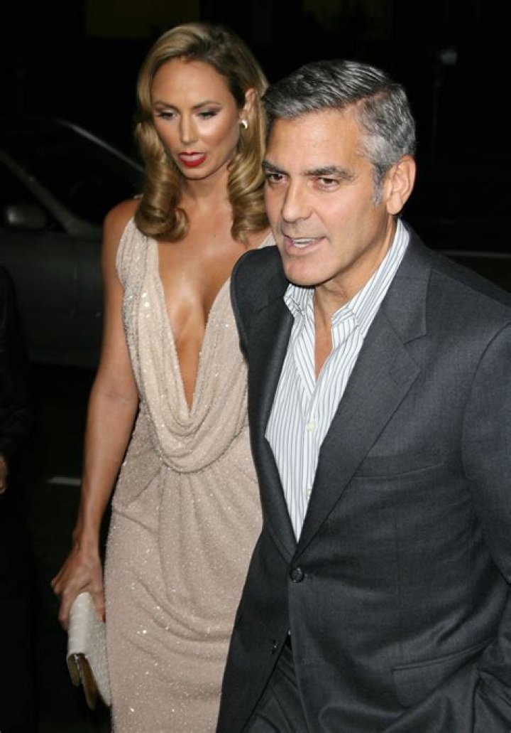 Stacy Keibler with Clooney, in low-cut Naeem Khan: classic Oscar Barbie?